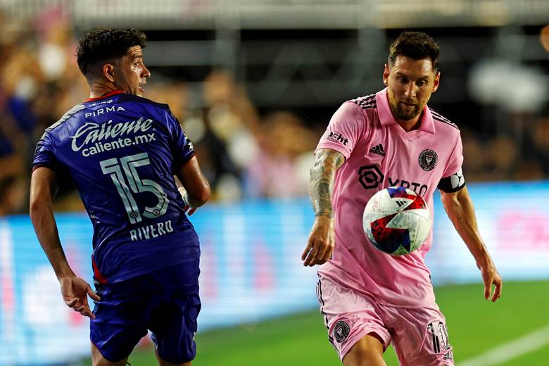 Two men playing football on a field

AI-generated content may be incorrect.