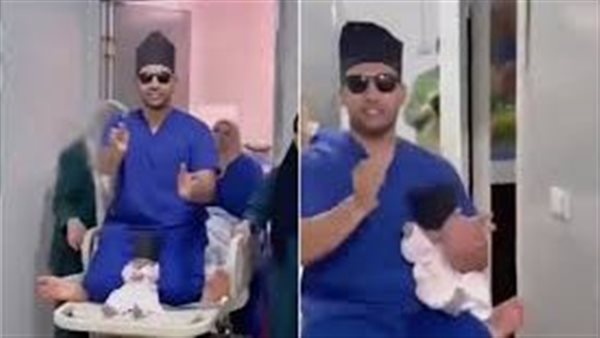 طبيب يرقص حاملا طفلا
